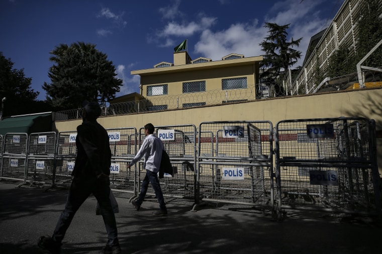 People walk past the the consulate in Istanbul