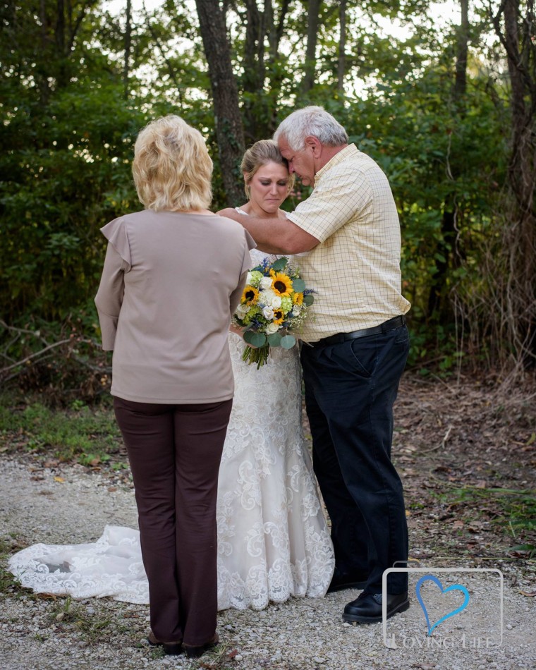 Bride-to-be mourns at fiance's grave in wedding gown