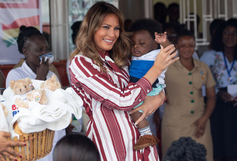 Image: First lady Melania Trump holds a baby in Accra, Ghana