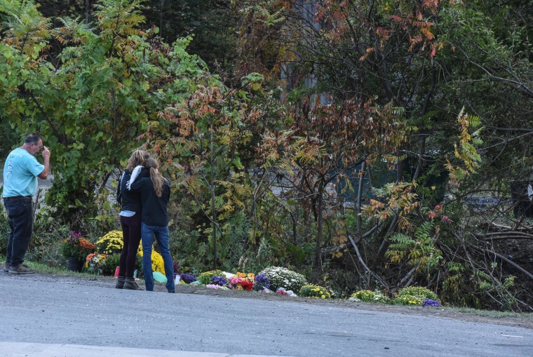 People mourn at the site of the fatal limousine crash in Schoharie, New York  on Oct. 8, 2018.