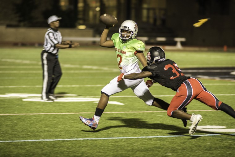 Quarterback Jalen Webb-Starkey tries to elude the Dunbar pressure in the second half.