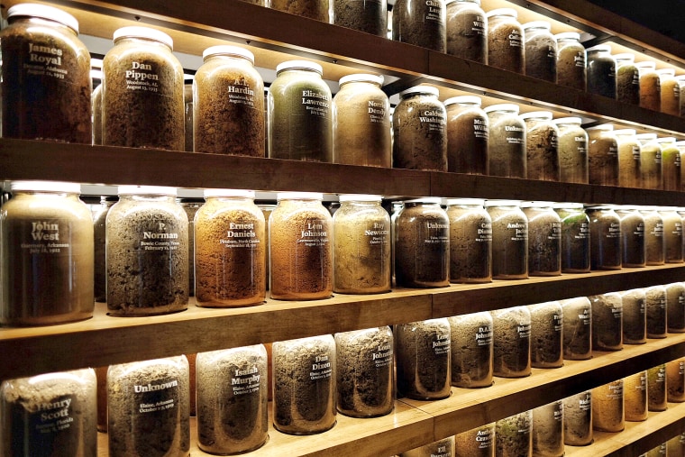 Jars of soil from over 280 lynching sites around the country sit on shelves in the Equal Justice Initiative office on Oct 9, 2018.