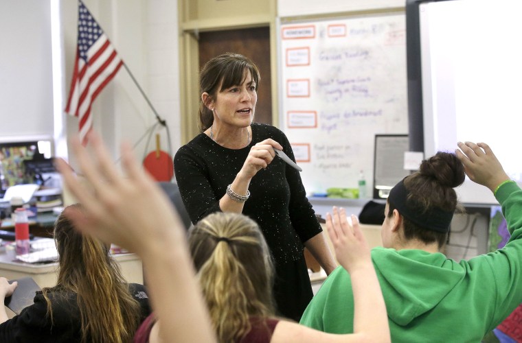 Image: High school teacher Natalie O'Brien, center, calls on students during a civics class called "We the People,"