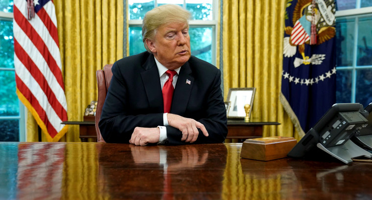 Image: U.S. President Trump speaks to reporters in the Oval Office at the White House in Washington