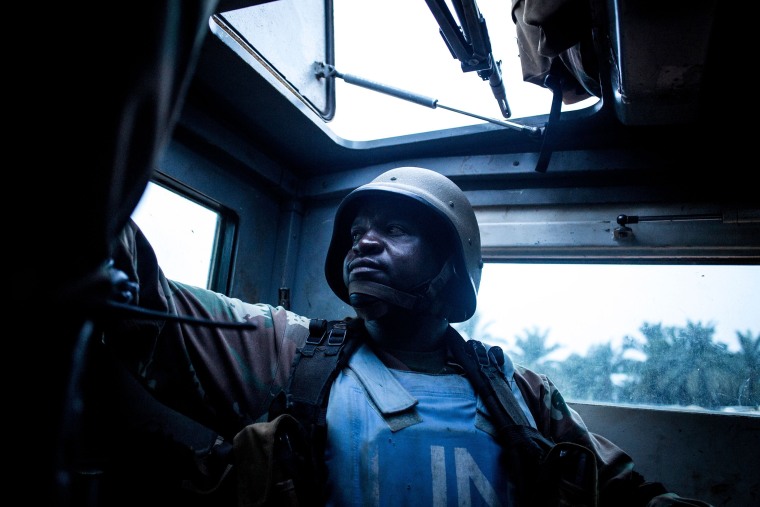South African soldier from the United Nations Stabilisation Mission in the Democratic Republic of the Congo (MONUSCO) sits in the back of an armored personal carrier on Oct. 5, 2018 in Oicha. - The town of Oicha is the site of constant attacks by the Allied Democratic Front (ADF) rebel group. MONUSCO soldiers are sent to help the Armed Forces of the Democratic republic of the Congo(FARDC) in the fight against ADF.