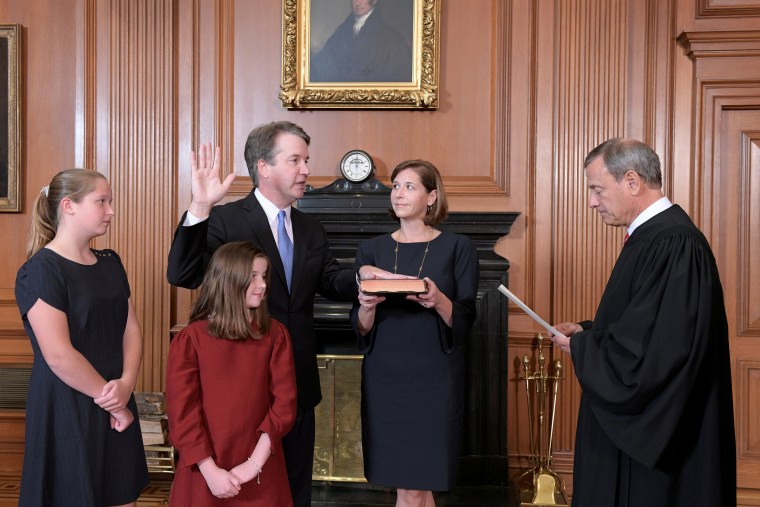 udge Brett Kavanaugh is sworn in as an Associate Justice of the U.S. Supreme Court by Chief Justice John Roberts at the Supreme Court in Washington