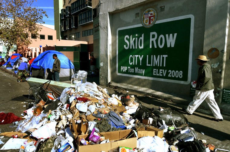 Trash lies beside the Skid Row City Limit mural as the city begins its annual homeless count in Los Angeles on Jan. 26, 2018.