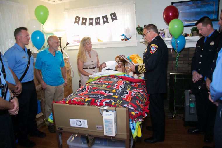 Samuel was visited by the Sheboygan fire and police departments during his adoption ceremony, where he was named an honorary firefighter.
