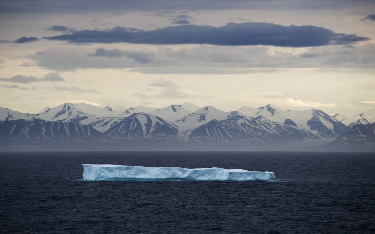 Image: An iceberg floats past Bylot Island in the Canadian Arctic Archipelago