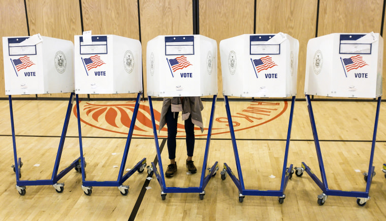 Image: A person fills out a ballot during primary election voting in New York on Sept. 13, 2018.