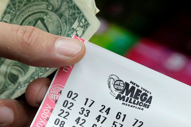 Image: A ticket is seen ahead of the Mega Millions lottery draw which reached a jackpot of $415 Million in Manhattan, New York, U.S.