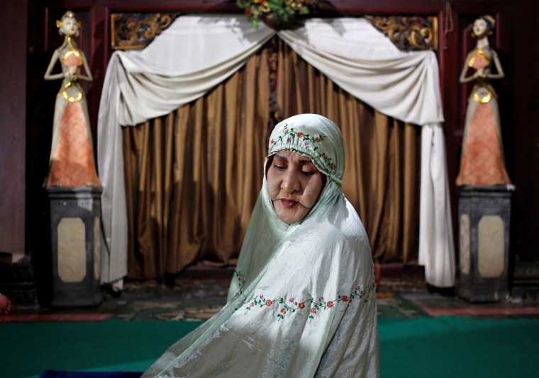 Image: Shinta Ratri, owner of Islamic boarding school for transgender women, sits in prayer in Yogyakarta