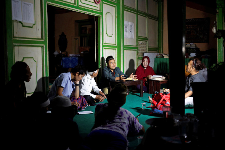 Image: A group of transgender women listen to cleric Arif Nuh Safri as he leads a Koran study session in Yogyakarta