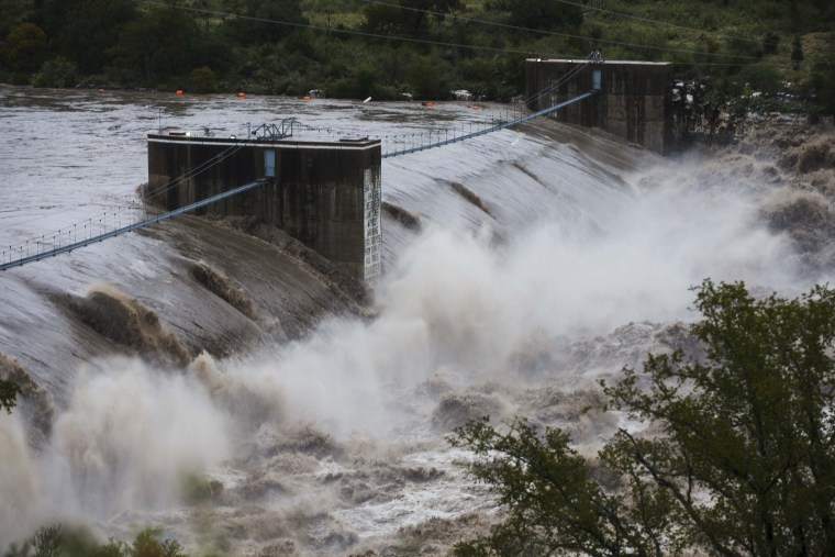 Water from the Colorado River pours over the Max Starcke Dam, Tuesday Oct. 16, 2018, in Marble Falls, Texas. The Llano and Colorado rivers meet at Kingsland and the National Weather Service said both were experiencing "major flooding." A flash flood warning was in effect.