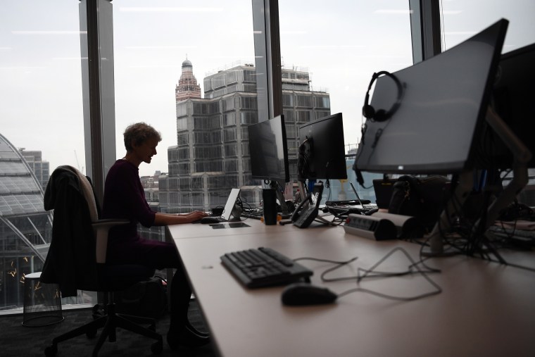 A staff member poses for a photograph at a workspace in the National Cyber Security Centre in London, on Feb. 14, 2017.