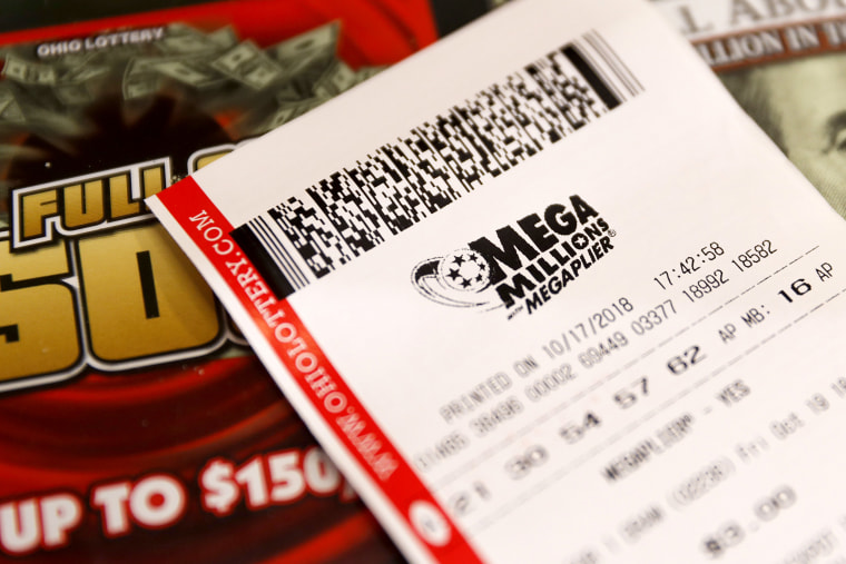 Image: A Mega Millions lottery ticket rests on the shop counter at the Street Corner Market on Oct. 17, 2018, in Cincinnati.