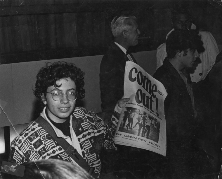 Martha Shelley sells Gay Liberation Front paper during Weinstein Hall demonstration