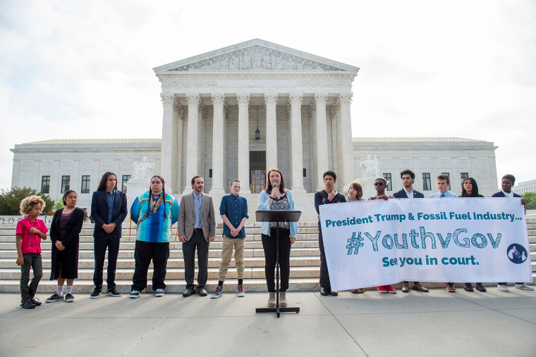 Youth plaintiffs speak during a press conference on the sidewalk in front of the United States Supreme Court in Washington. The youth are part of 21 plaintiffs in a landmark federal lawsuit which accuses the federal government of violating their constitut