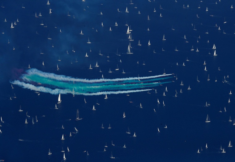 Image: The Italian Frecce Tricolori aerobatic squad performs before the start of the Barcolana regatta in front of the Trieste harbour