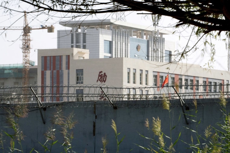 Image: Razor wire protects a cluster of schools on the outskirts of Kashgar, in western China's Xinjiang.