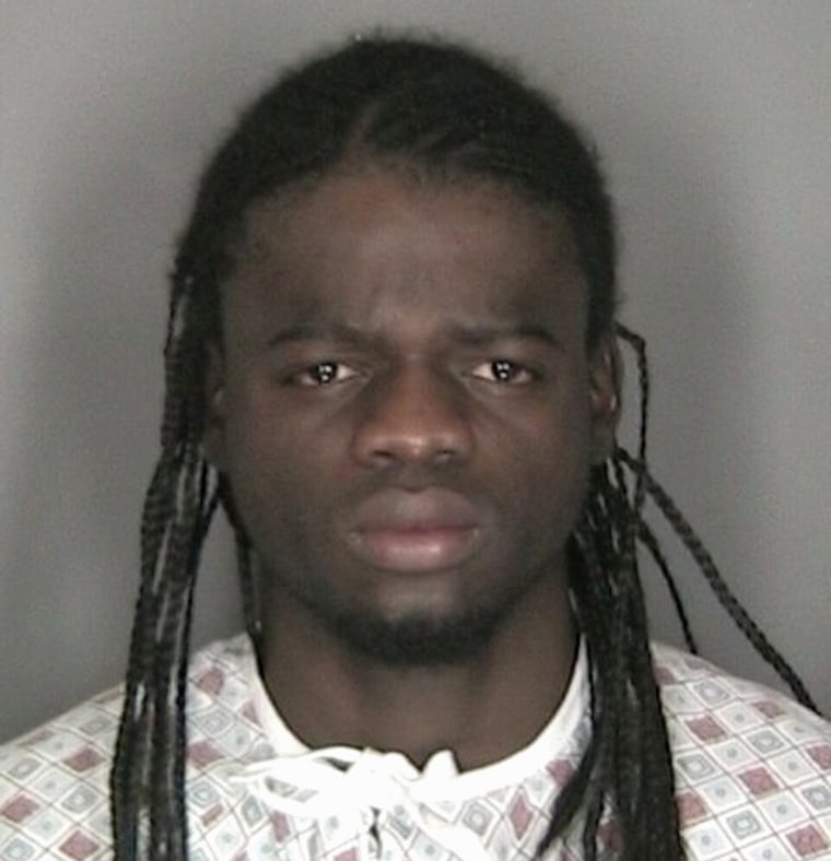 Image: Murder suspect Wint is pictured in police booking photograph