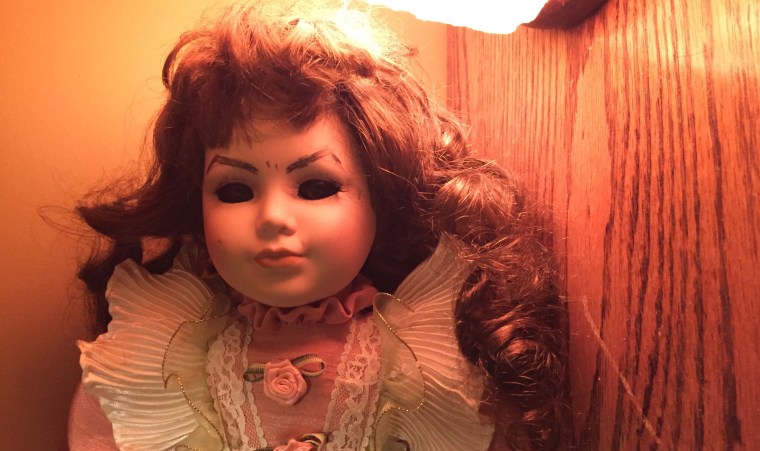 Krystah Wright's daughter, Adele, 7, collects "creepy" porcelain dolls from thrift stores. After Adele threw this doll away because it "scared her too much," Wright started hiding her around the house in different poses.