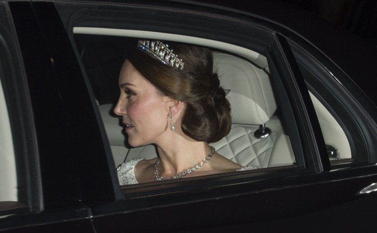 Former Kate Middleton wears Princess Diana's tiara for royal Christmas banquet.
