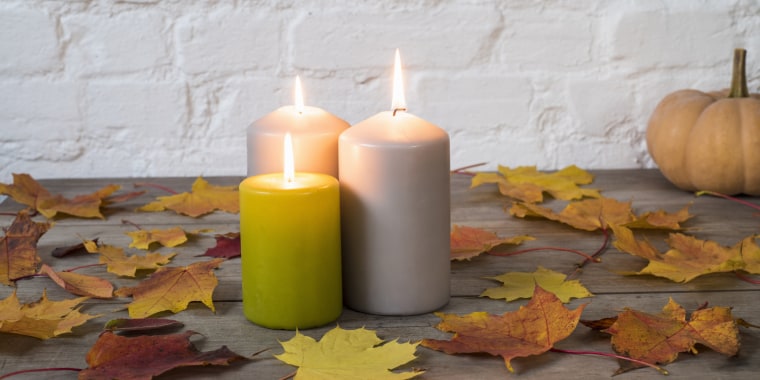 Candles and autumn leaves