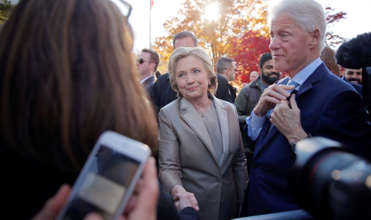 Image: Then-Democratic presidential nominee Hillary Clinton and her husband former President Bill Clinton meet with supporters