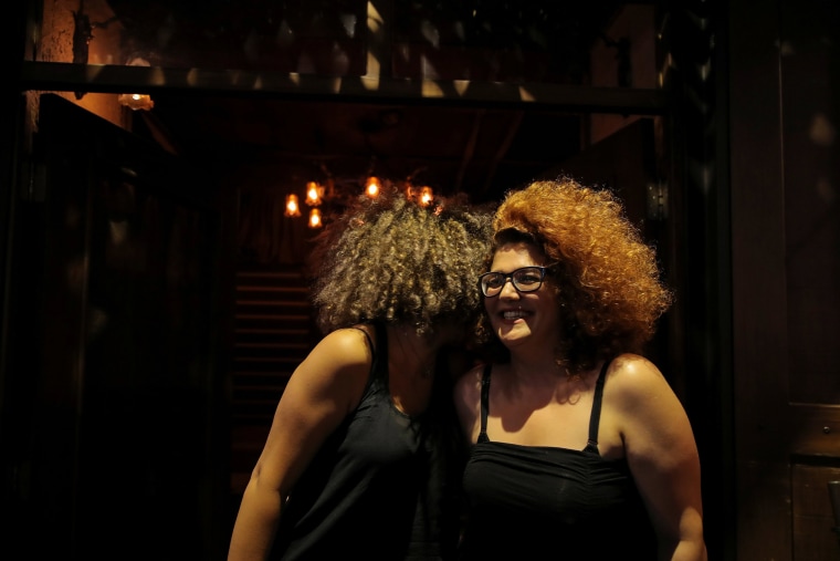 Image: Two women talk to each other in a bar in the Old City of Damascus, Syria