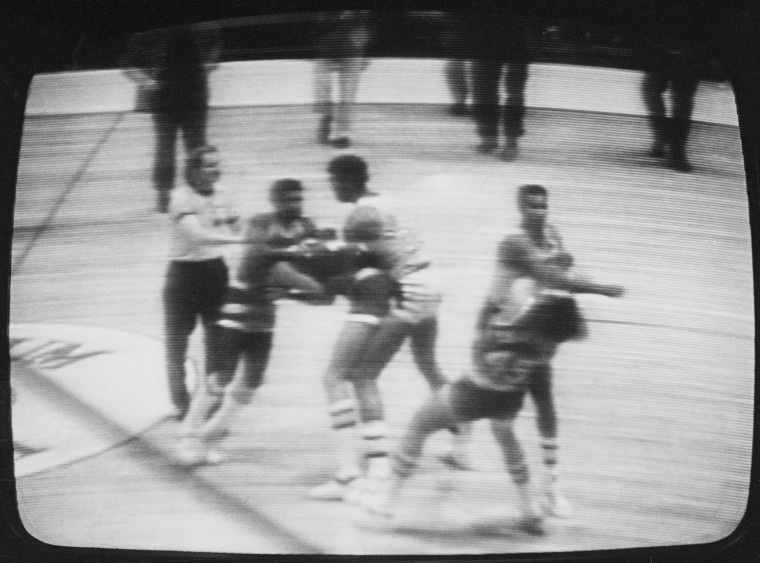 Los Angeles Lakers forward Kermit Washington was fined an NBA league-maximum $10,000 and suspended for at least 60 days by NBA Commissioner Lawrence O'Brien for punching Houston's Rudy Tomjanovich in this game at the Inglewood, California, Forum in December 1977. 