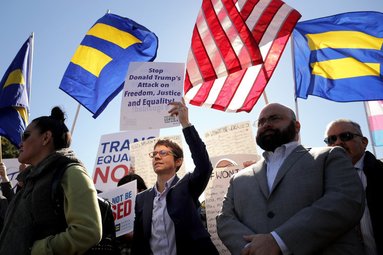 Activists from the National Center for Transgender Equality, partner organizations and their supporters hold a 'We Will Not Be Erased' rally in front of the White House on Monday.