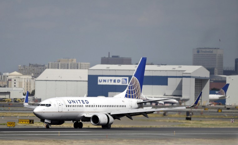 Image: A United Airlines passenger plane lands at Newark Liberty International Airport