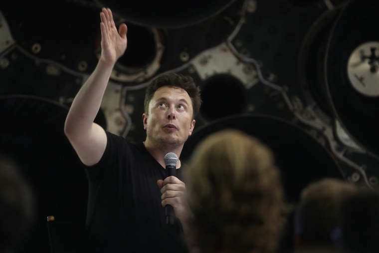 SpaceX CEO Elon Musk speaks in front of rocket components at a press conference where he announced the Japanese billionaire chosen by the company to fly around the moon, on Sept. 17, 2018 in Hawthorne, California.