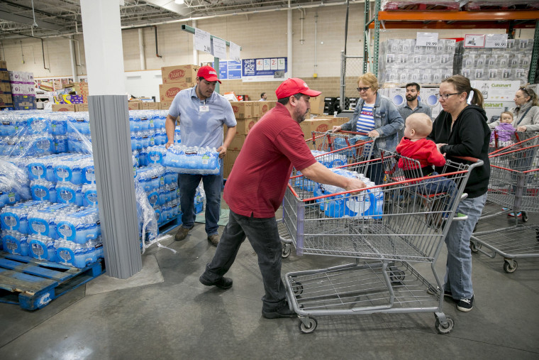 Customers get water bottles at Costco in Southwest Austin, Texas on Oct. 23, 2018, during a city-wide boil water notice caused by flooding.
