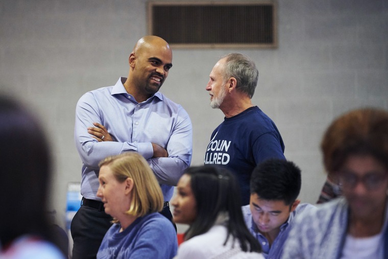 Congressional candidate Colin Allred speaks with an attendee at a fish fry hosted by the Dallas County Democratic Party in Dallas on Oct. 19, 2018.