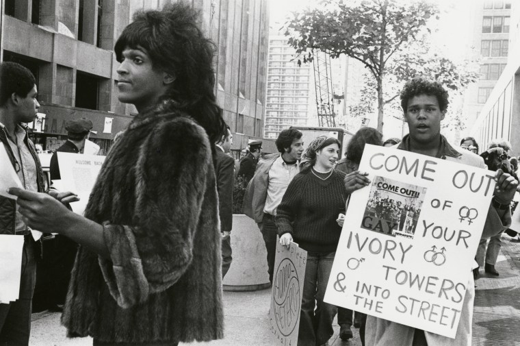 Marsha P. Johnson hands out flyers for support of gay students at NYU in 1970.