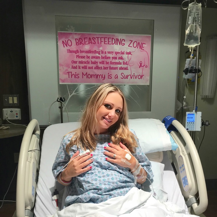 Meghan Koziel had a creative banner made before she gave birth to her daughter, Kendra, in September. The banner explained that Koziel was a breast cancer survivor and was unable to breastfeed her newborn.