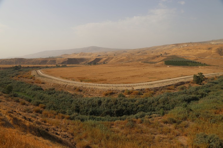 Image: The Jordan River runs through the Baqoura area, called the Island of Peace