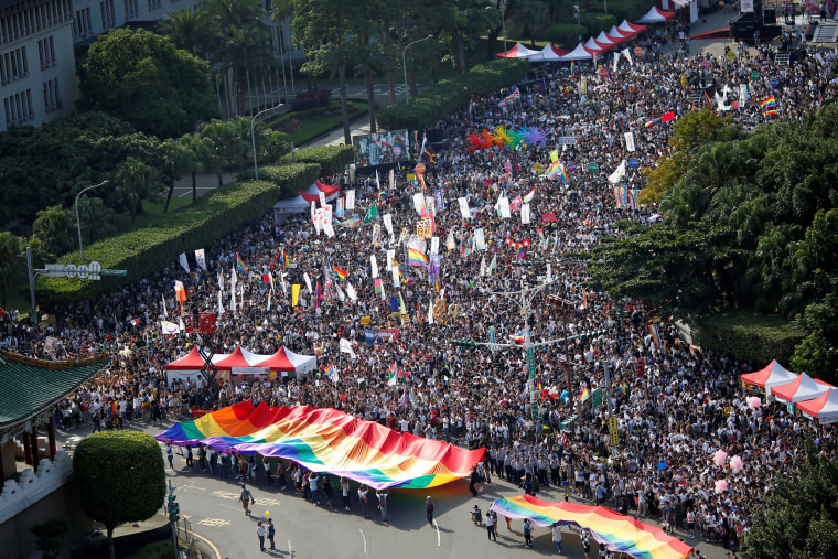 Image: Participants take part in a LGBT pride parade to support same-sex marriage in Taipei