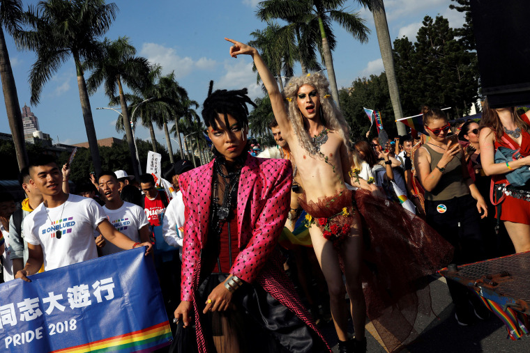 Image: Participants take part in a LGBT pride parade to support same-sex marriage in Taipei