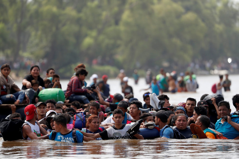 Image: Central American migrants cross the Suchiate river, the natural border between Guatemala and Mexico