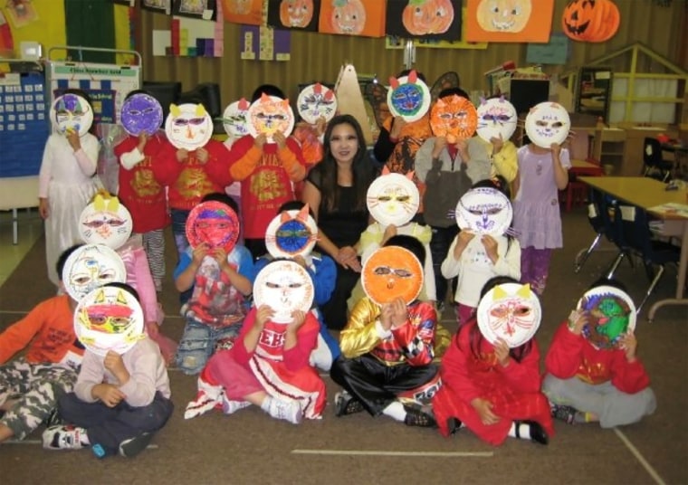 Image: Monica Lun and her students in paper plate masks