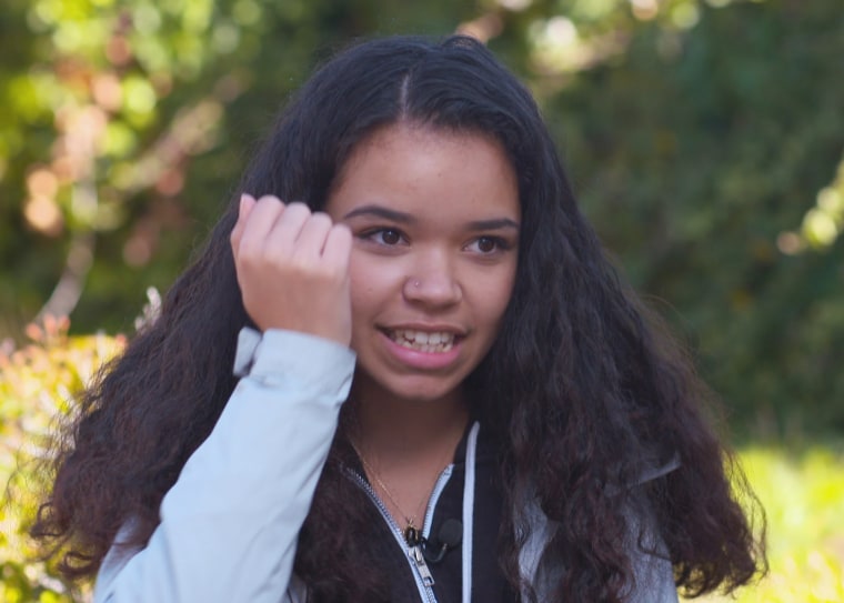 Olivia Gordon, who participated in the UCSF study on the effects of teen use of e-cigarettes, demonstrates how students at her high school would hide Juul in their jacket sleeves and sneak puffs of the flavored nicotine vapor during class