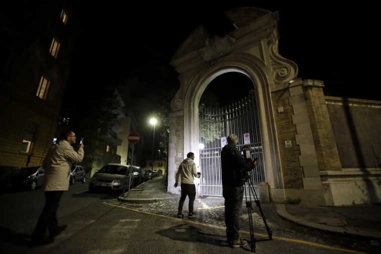 Image: Reporters outside the Vatican Embassy to Italy