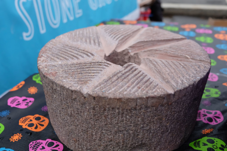 Image: Grinding stone carved by Molinero