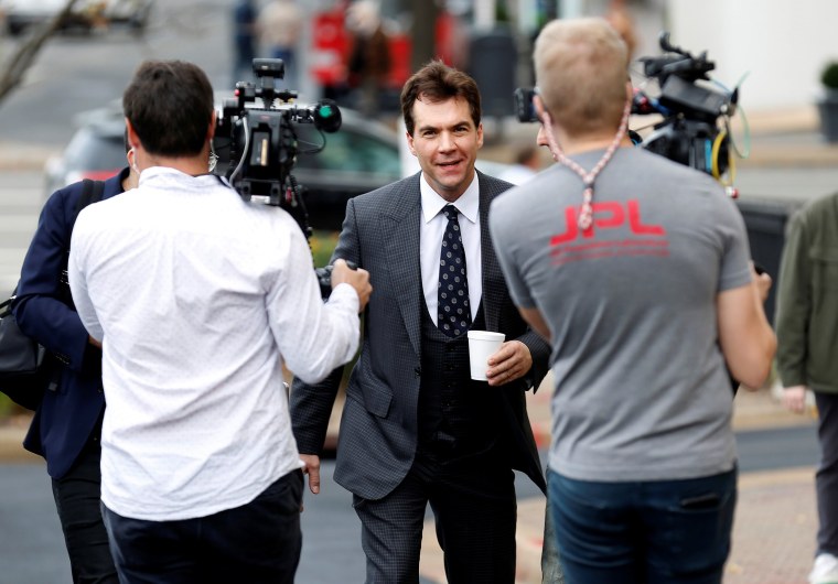 Jack Burkman, a lawyer and Republican operative, is followed by the media after a news conference on his allegations against Special Counsel Robert Mueller in Arlington, Virginia