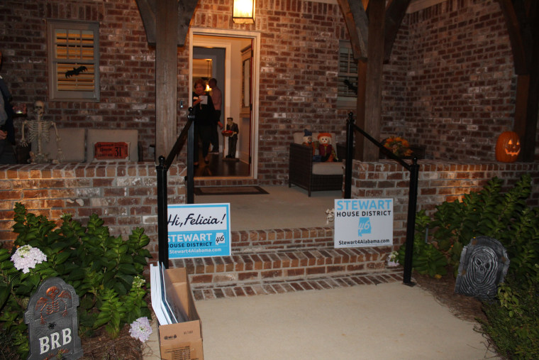 Image: Signs decorate a home hosting a meet and greet for Felicia Stewart.