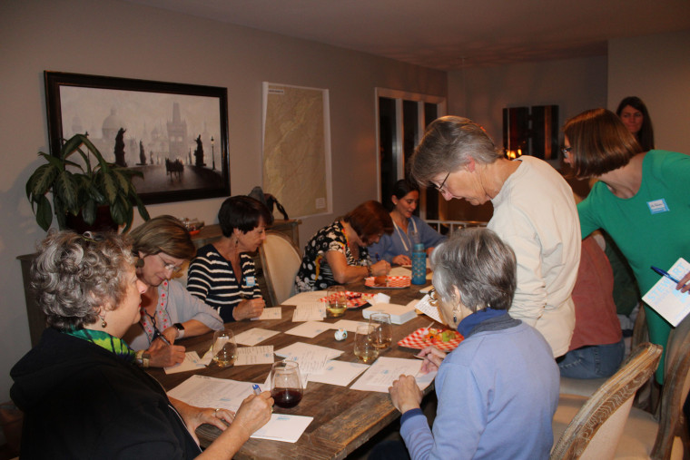 Image: Volunteers gather to write postcards supporting Felicia Stewart