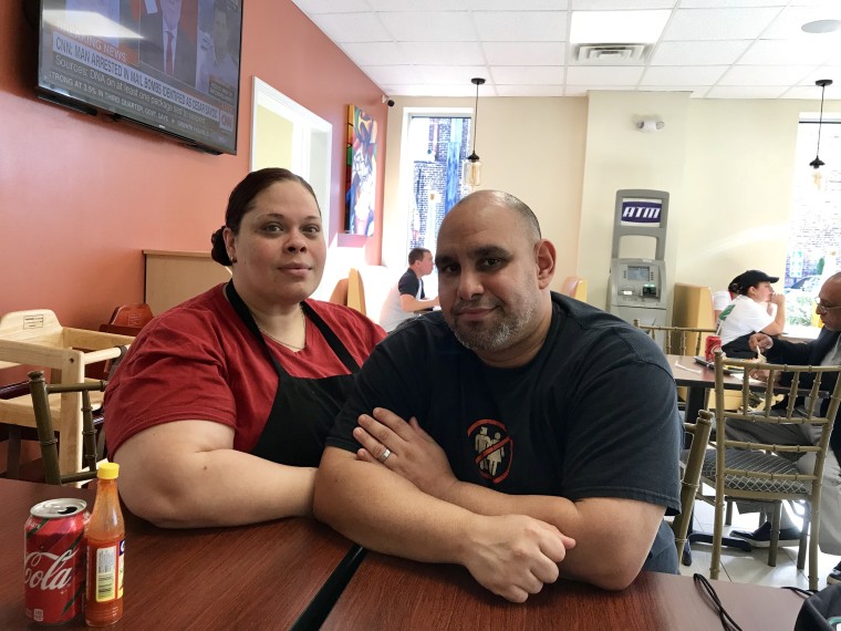 Dionimar Cortes, 39, and her boyfriend Carlos Santiago, 38,  at "El Coquito" restaurant in Bridgeport, CT, a popular haunt for Puerto Ricans. The couple were relocated to the U.S. after Hurricane Maria destroyed their home.